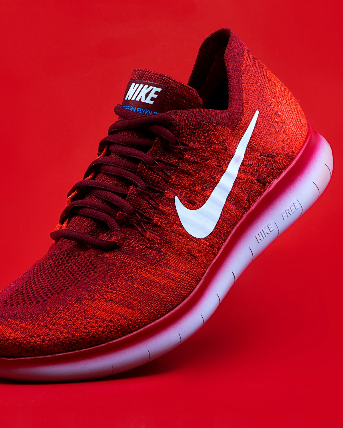 Red Nike running sneaker