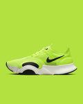 Green and black athletic running shoe