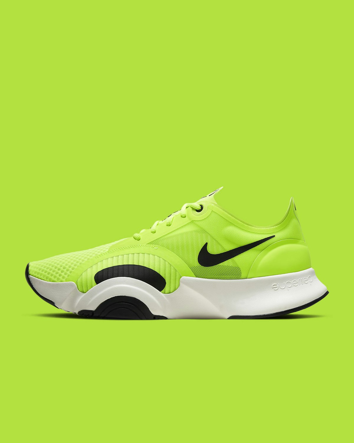 Green and black athletic running shoe